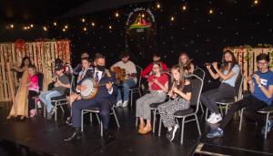 Children playing music together at the festival | NICRC