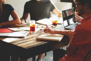 Several people working together at a table | CRC NI