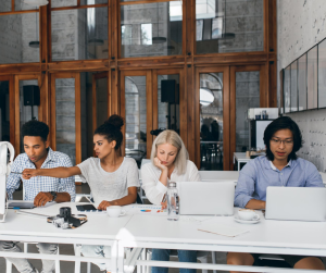 People working together at separate laptops | NICRC